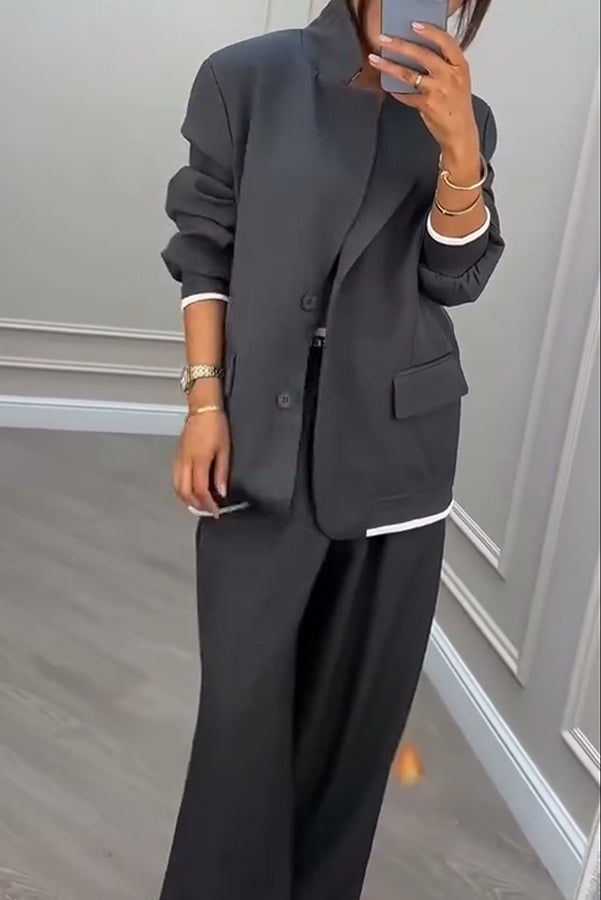 Overhead view of the Calliope ribbed colour block blazer and trousers set laid flat, displaying its full design.