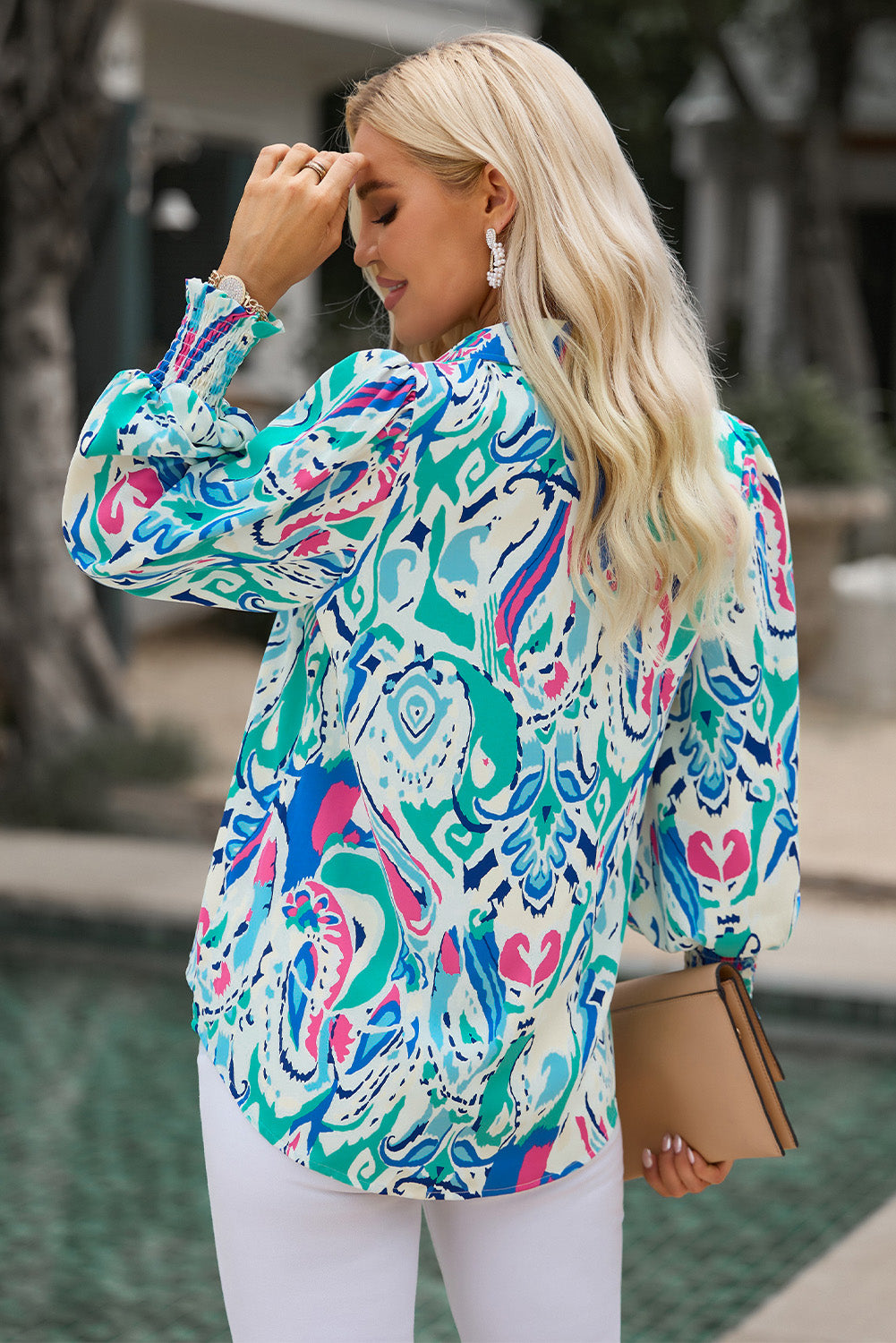 Overhead view of the pastel blue printed puff sleeve blouse, displaying the overall shape and print.
