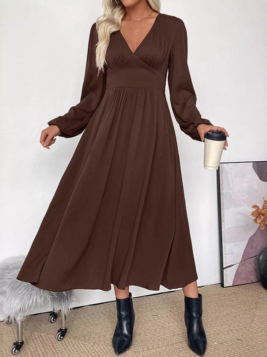 Front view of a brown Adara V-neck long sleeve midi dress, showcasing its elegant drape and smocked waist.