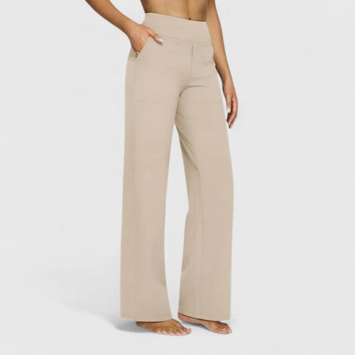 Front view of a woman wearing cream Adeline pull-on trousers, showcasing the relaxed yet tailored fit.