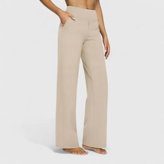 Front view of a woman wearing cream Adeline pull-on trousers, showcasing the relaxed yet tailored fit.