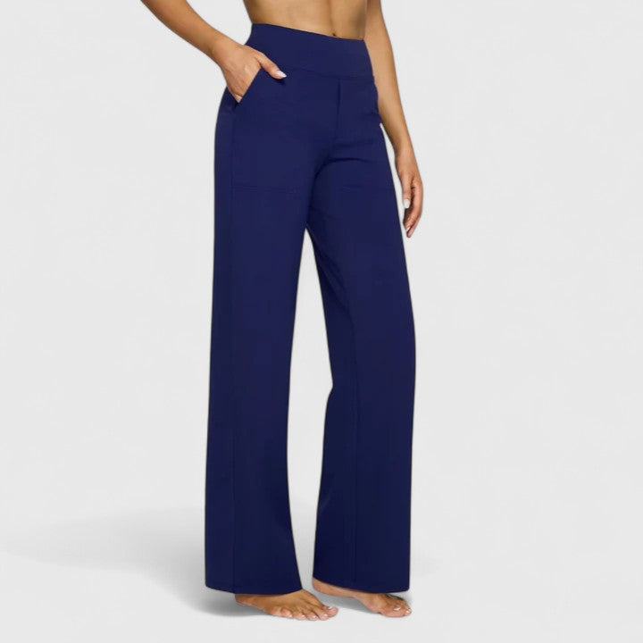 View of the back of the white Adeline pull-on trousers, featuring the decorative pocket detail for a smart finish.