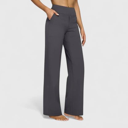 Folded pair of brown Adeline pull-on trousers, displaying the fabric texture and quality.