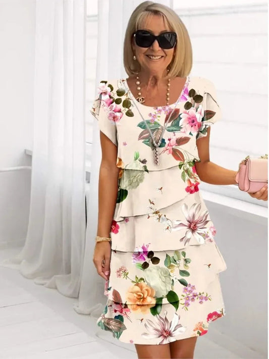 Front view of the Alani floral A-line midi dress in apricot, showcasing its comfortable fit and elegant design.