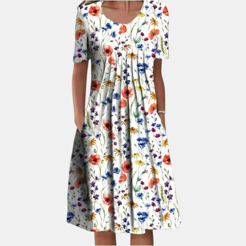 Front view of the Alessia cotton tummy control dress in a vibrant red floral pattern, showcasing the relaxed fit.