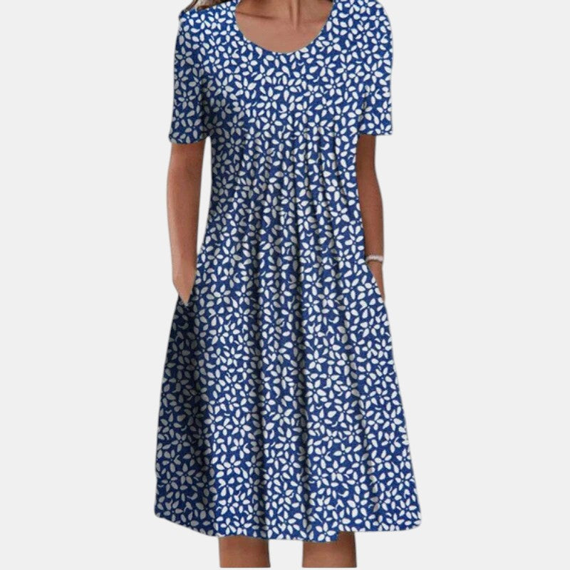 Back view of the Alessia dress, showing the smooth lines and comfortable short sleeves, perfect for women's wear.