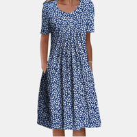 Back view of the Alessia dress, showing the smooth lines and comfortable short sleeves, perfect for women's wear.