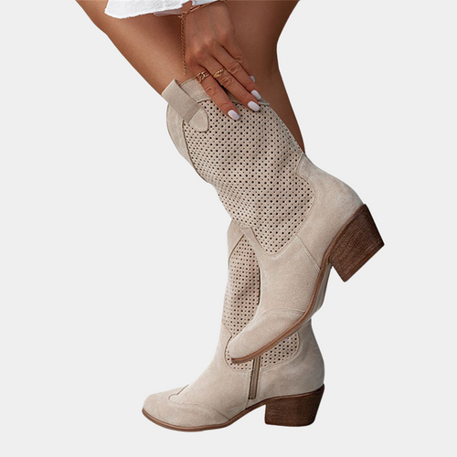 Close-up of the front of the brown orthopaedic cowboy boots, highlighting the intricate stitching details and material texture.
