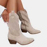 A pair of white orthopaedic cowboy boots from a high angle, displaying the full boot length and comfortable wide opening.