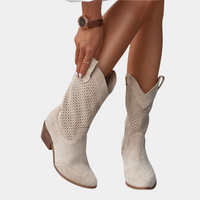 Stylish black orthopaedic cowboy boots, modelled on a person, demonstrating their versatile look for urban and casual wear.