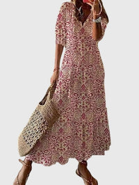Woman twirling in the Anthea boho vintage summer dress, showcasing its lightweight and breezy movement.