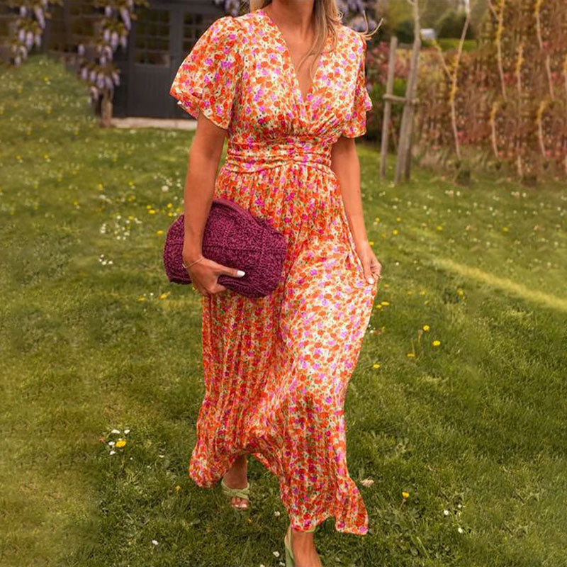 Side profile of a model wearing the green Antonia A-Line Dress, demonstrating the fluid movement of the skirt.