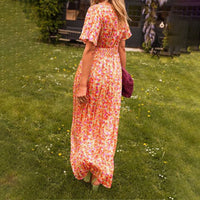 Lifestyle shot of the red Antonia A-Line Dress, styled for a daytime casual event, with accessories.
