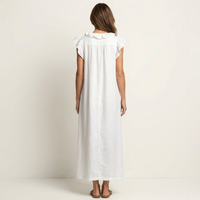 A purple Artemis effortless ruffle maxi dress styled with sandals for a comfortable yet chic ensemble.