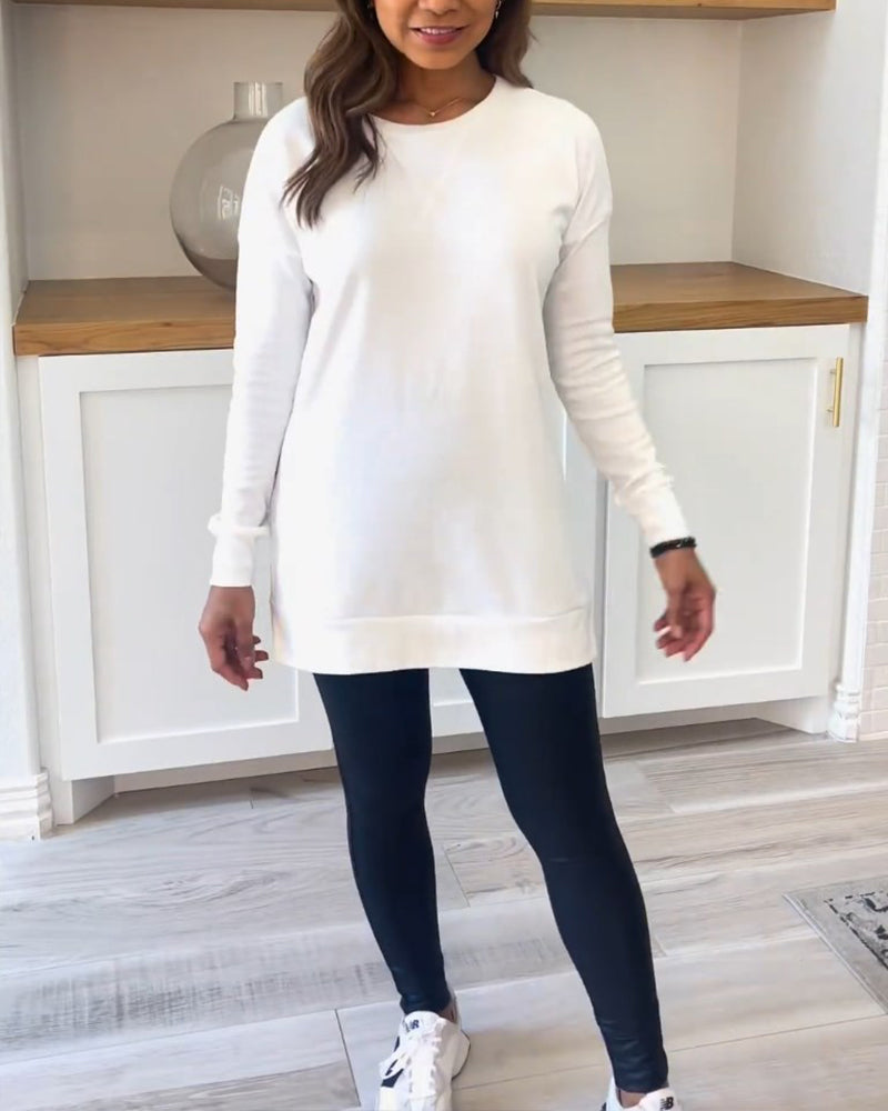 A model wearing the white Aurelia long sleeve top, paired with jeans, demonstrating a casual yet polished everyday look.