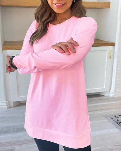 Rear view of the pink Aurelia long sleeve top, displaying the full length of the top and the drape of the fabric.