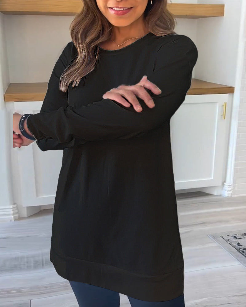 Lifestyle image of someone comfortably working from home in the white Aurelia long sleeve top, looking relaxed and chic.