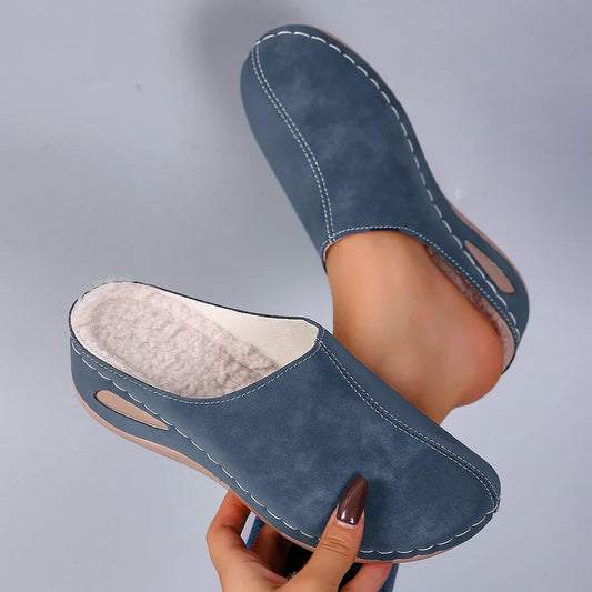 Pair of brown Seraphina orthopaedic comfort slippers, side view, showcasing the closed-toe design.