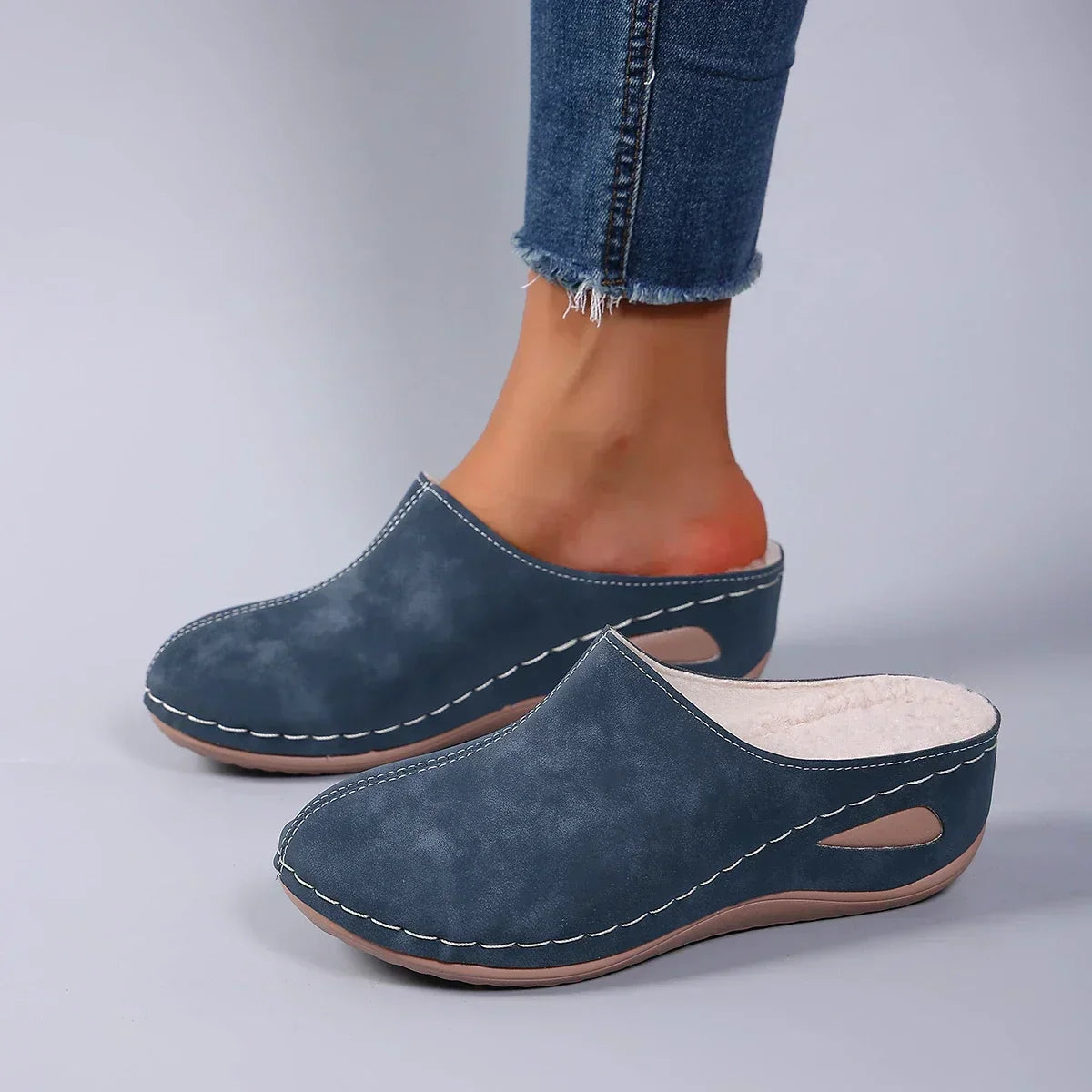 Close-up of the cushioned footbed within a blue Seraphina orthopaedic slipper, highlighting the arch support.