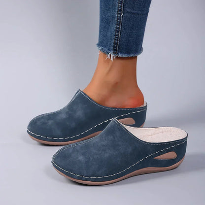 Close-up of the cushioned footbed within a blue Seraphina orthopaedic slipper, highlighting the arch support.