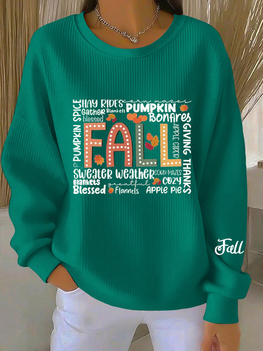 Front view of a blue-green women's graphic crew neck sweatshirt, showcasing the large central text design and ribbed details.