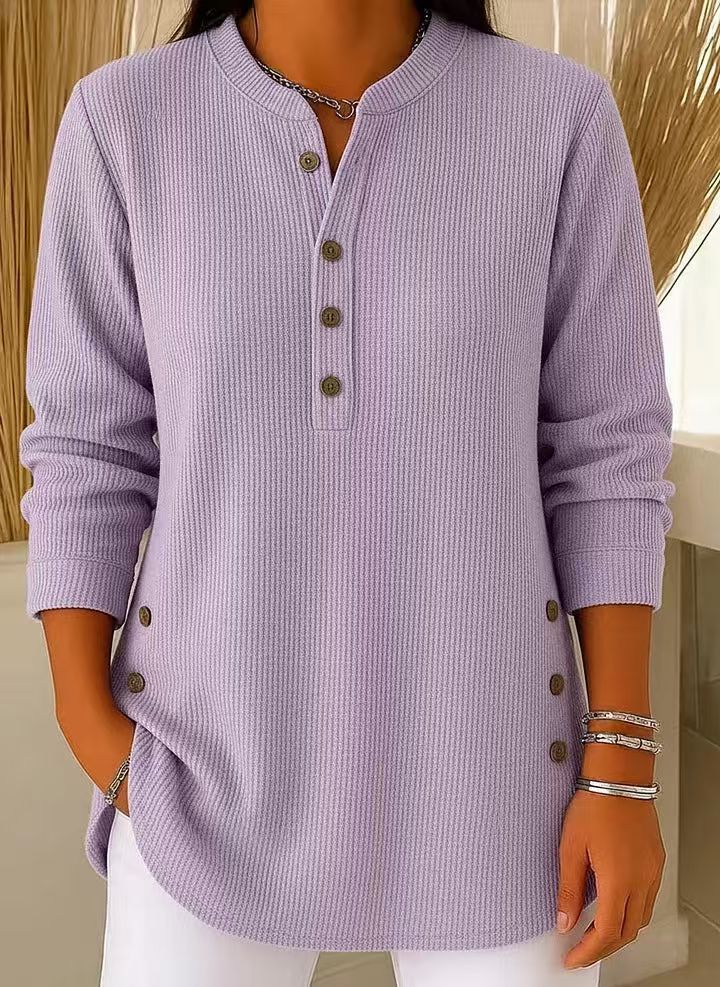Detail shot of the sleeve cuff and ribbed texture on the dark brown Bronte long sleeve top.