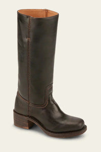 Lifestyle image of a woman walking outdoors wearing black Calista classic mid-calf boots and jeans.
