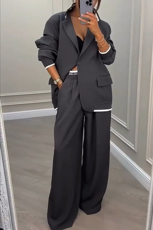 Front view of the Calliope ribbed colour block blazer and trousers set in ash, showing the full ensemble.