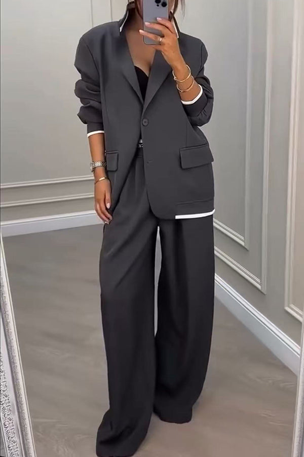 Side profile of a model wearing the Calliope ribbed colour block set, highlighting the loose fit and ankle-length trousers.