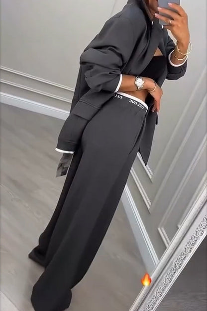 Back view of the Calliope ribbed colour block blazer and trousers set, showcasing the overall silhouette and design.