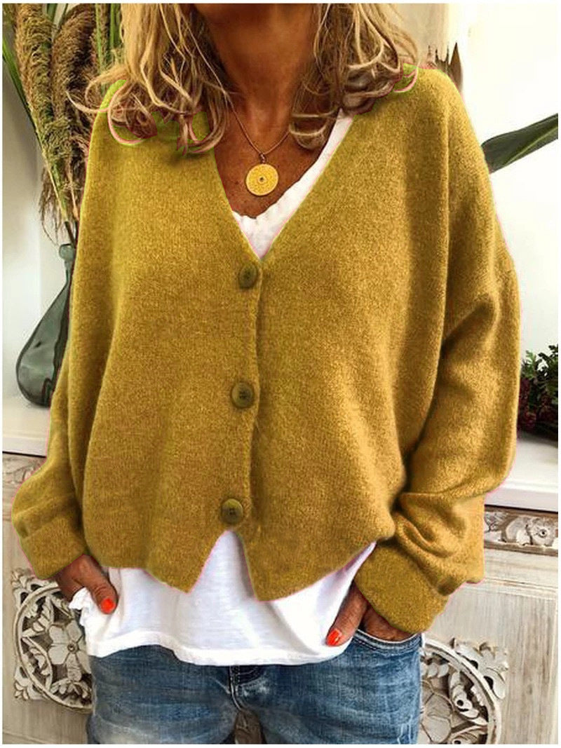 Yellow Calypso V-neck button cardigan in a lifestyle setting, adding a pop of colour to an outfit.