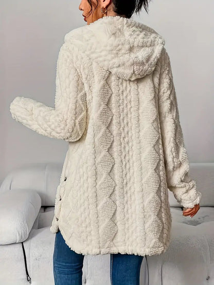 Overhead shot of the beige hooded knitted cardigan laid flat, showcasing its full textured design.