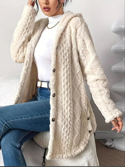 A model turning to reveal the side and back of the hooded knitted cardigan, demonstrating its drape.