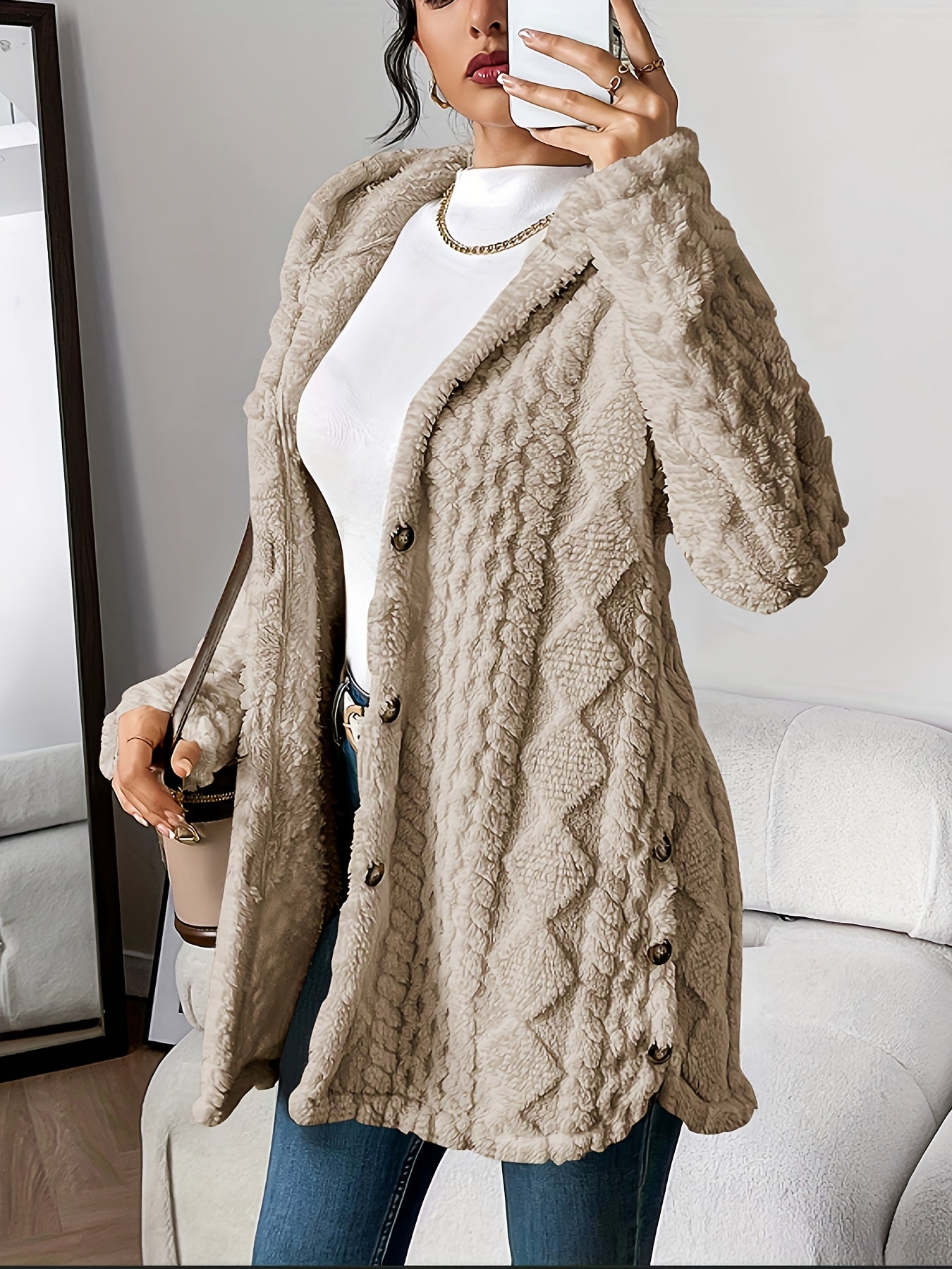 Detail of the integrated hood on the grey hooded knitted cardigan, highlighting its soft construction.