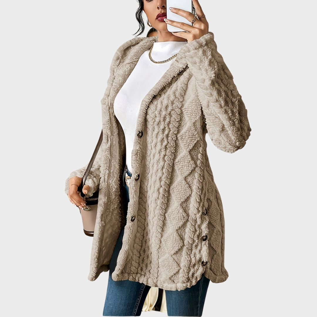 Side profile of a woman wearing the khaki hooded knitted cardigan, highlighting the longline silhouette.