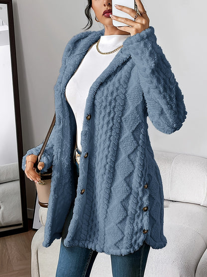 Close-up detail of the brown hooded knitted cardigan's irregular textured pattern and soft knit fabric.