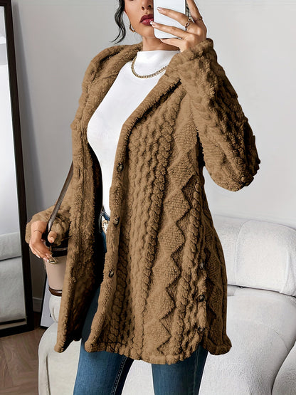 Back view of the grey hooded knitted cardigan, showing the continuous flow of the hood and hem.