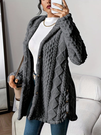 A model wearing the black hooded knitted cardigan, styled casually with jeans for a relaxed look.