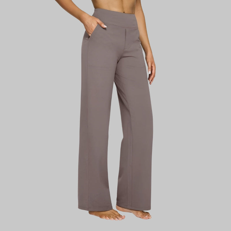 Front view of a woman wearing the taupe Clara comfortable stretch trouser in a studio setting.
