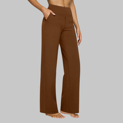 Woman in a white Clara comfortable stretch trouser, styled for a light, airy look.