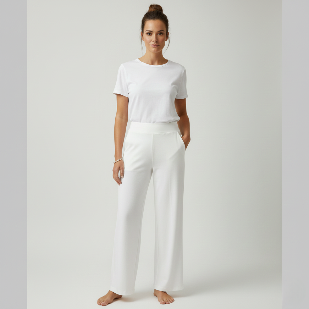 Stacked folded Clara comfortable stretch trousers in various colours, showing range.