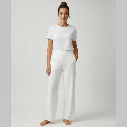 Stacked folded Clara comfortable stretch trousers in various colours, showing range.