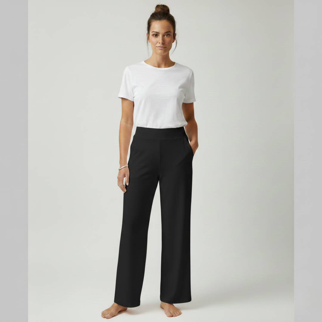 Overhead shot of a woman relaxing in the Clara comfortable stretch trouser, illustrating comfort.