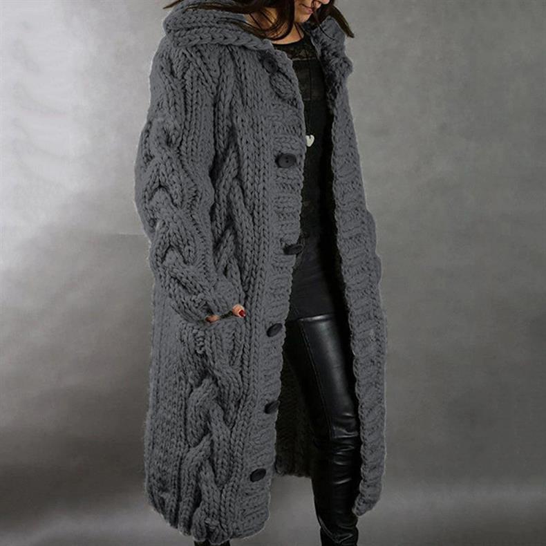 View of the deep side pocket on the knitted longline coat, demonstrating practicality and convenience.