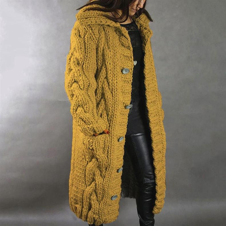 Close-up of the integrated hood detail on the premium cable knit longline coat, offering extra warmth.