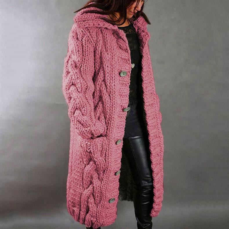 Woman posing casually, illustrating the everyday elegance and styling potential of the knitted longline coat.