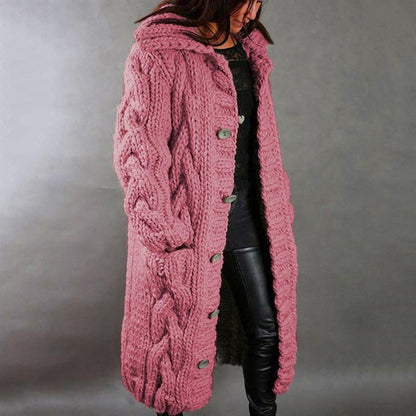 Woman posing casually, illustrating the everyday elegance and styling potential of the knitted longline coat.