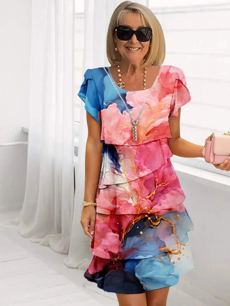 Front view of a woman wearing a flower pattern Serena ruffle A-line dress, showcasing the flowing silhouette and split sleeves.