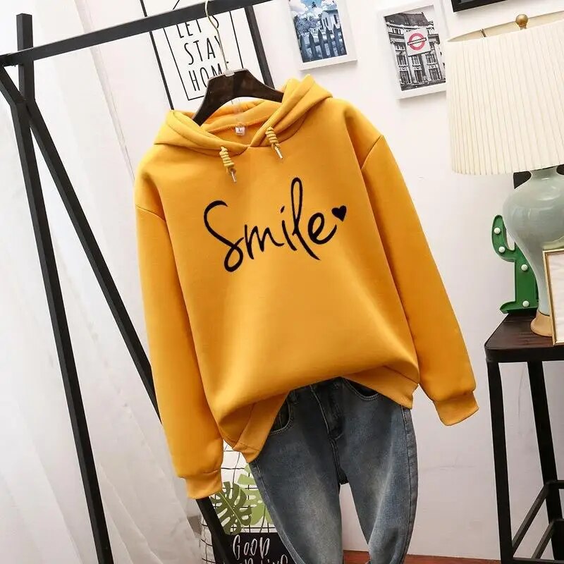 Back view of the yellow Cleo comfort hoodie, highlighting the overall silhouette and hood detail.