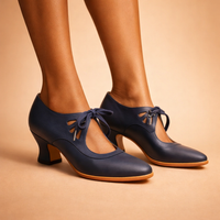 Full frontal view of the sophisticated brown leather shoes, highlighting their almond toe and sculpted heel design.